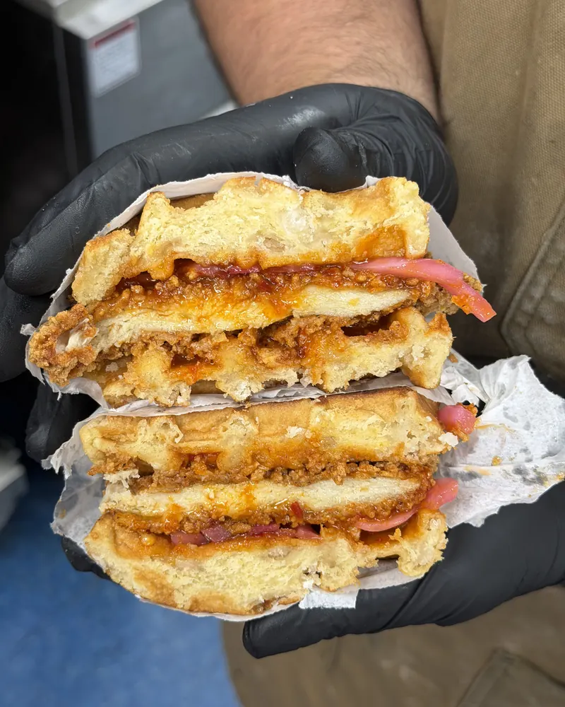 Chicken and waffle sandwich, cut in half