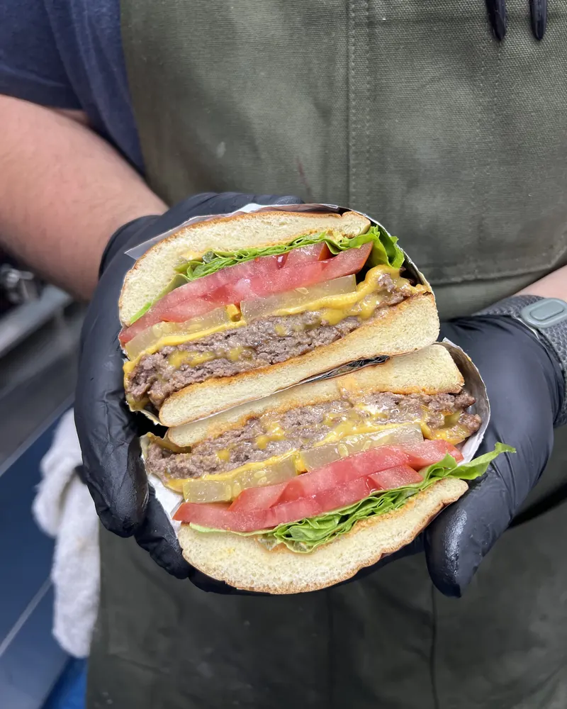 JB Smash burger with two house-ground patties, cheese, lettuce and tomato