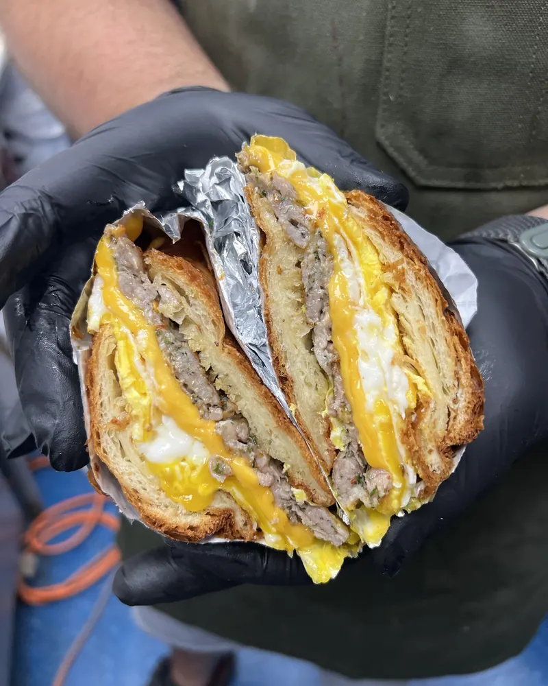 Sausage, egg and cheese on a croissant with house-made sausage